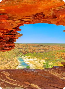 The Murchison River Gorge view through the rocks rippled with red and white of Nature's Window, in Kalbarri National Park, Western Australia.
